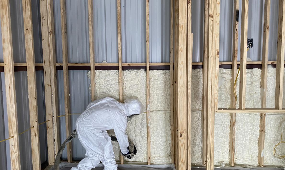 Image of a spray foam insulation professional installing new insulation to a building