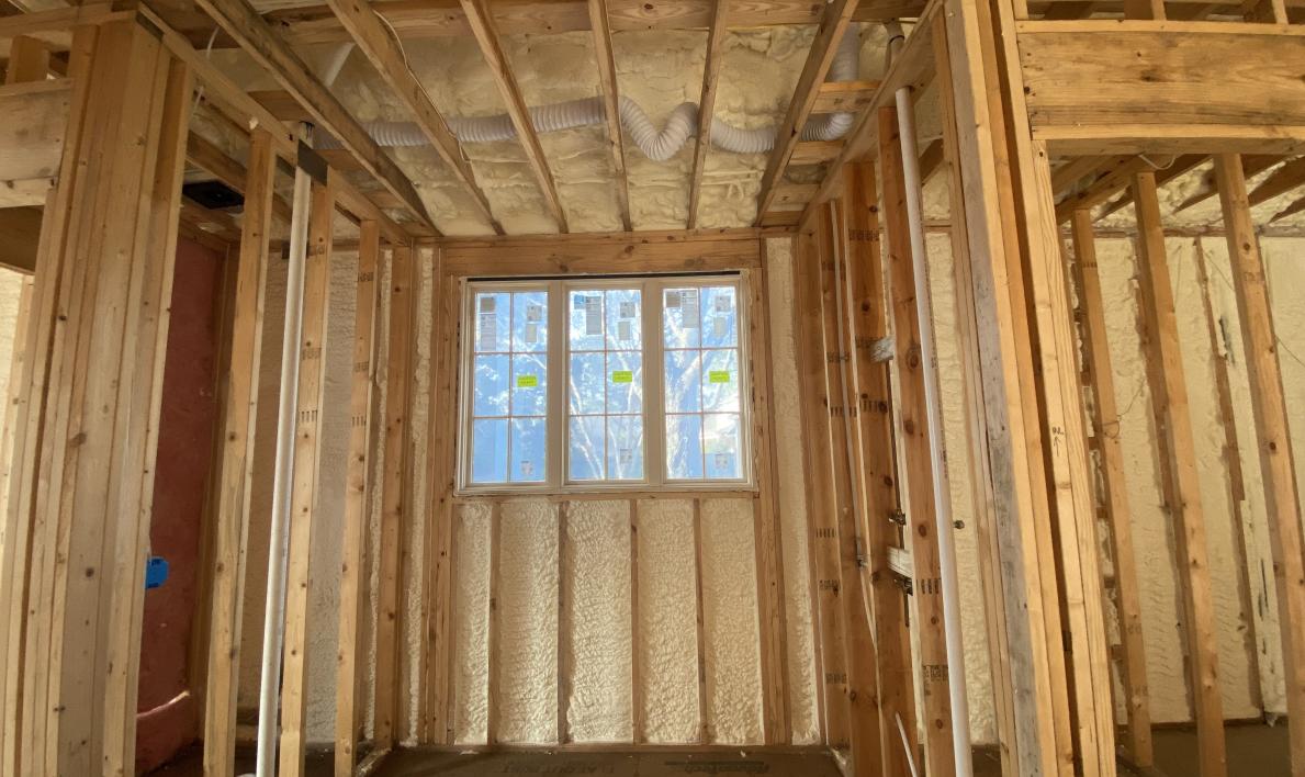 Image of bare exterior walls in need of insulation application